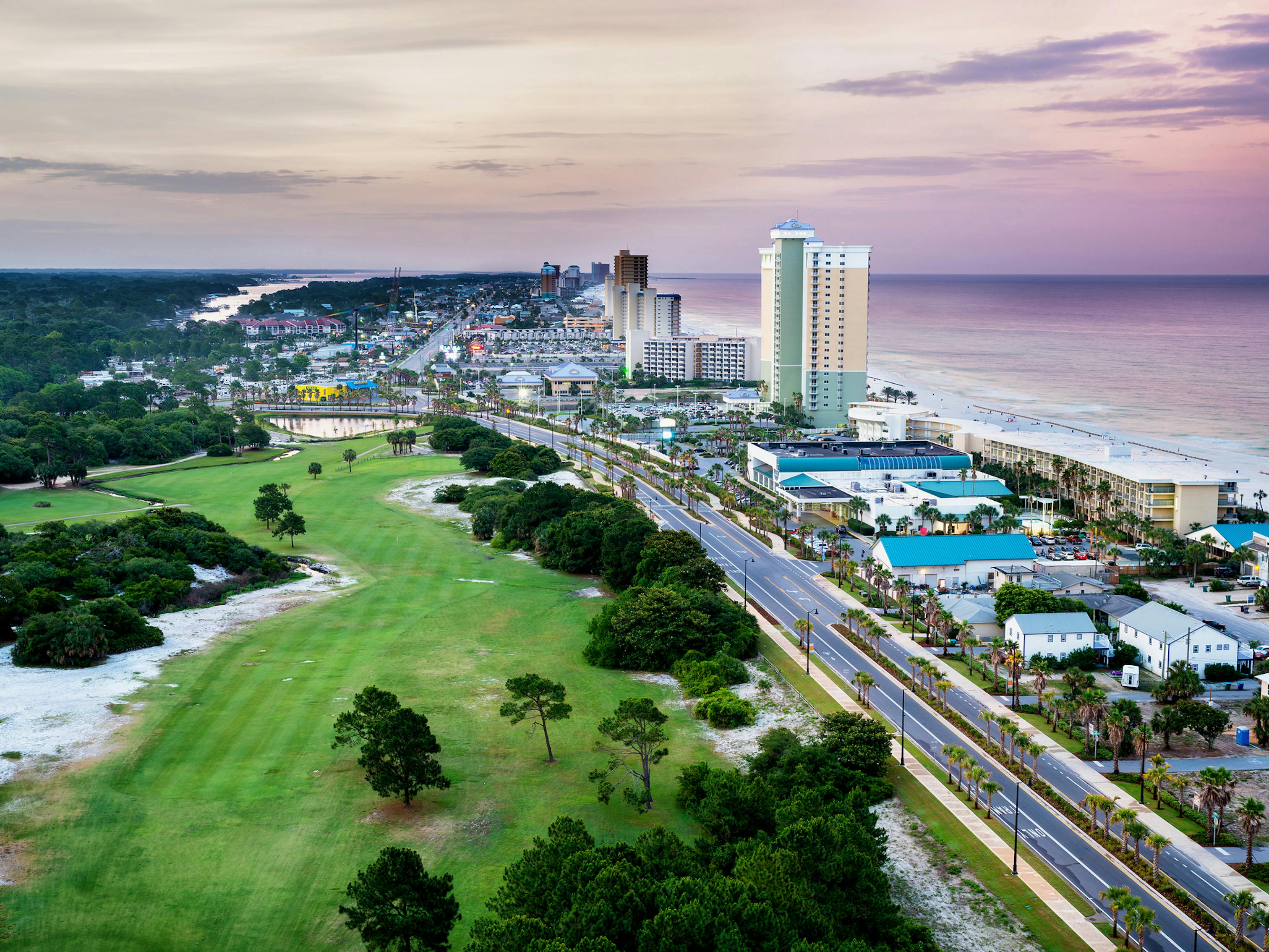 Panama City Beach coastline and Front Beach Road at sunrise.